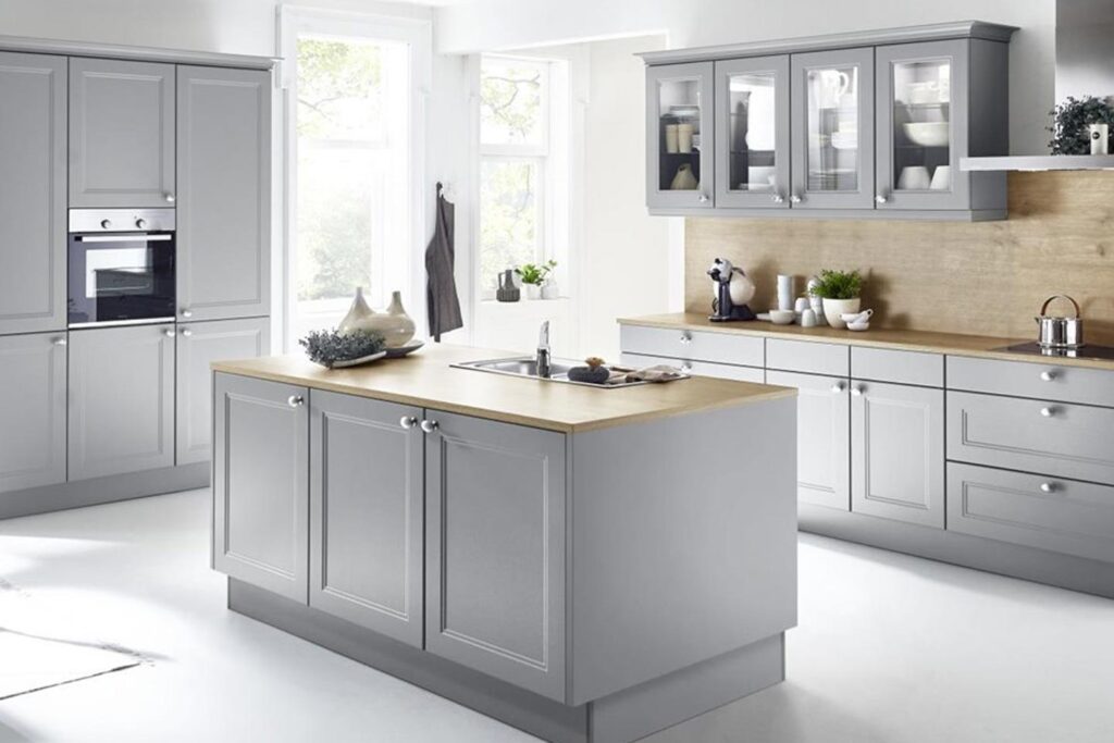 A grey kitchen island with a touch of nature Nolte Brasov