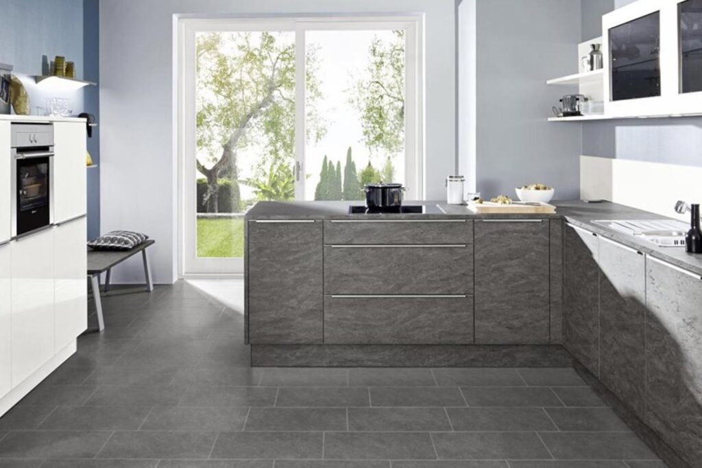 White kitchen cabinets combined with a stone look Nolte Brasov